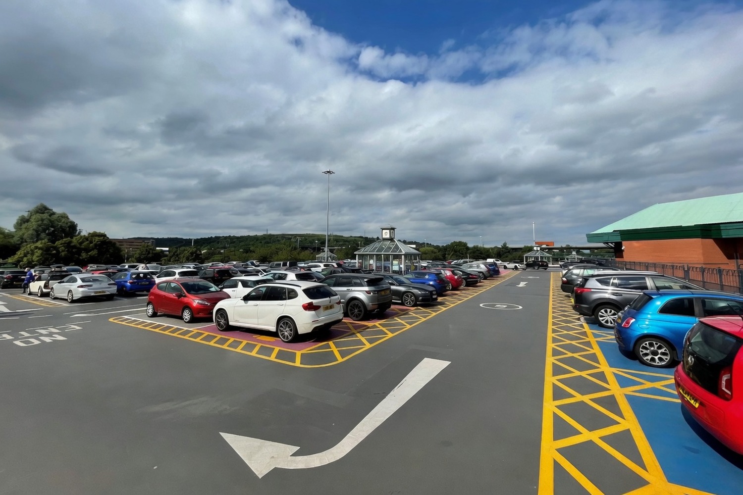 Large car park with freshly painted bays in use